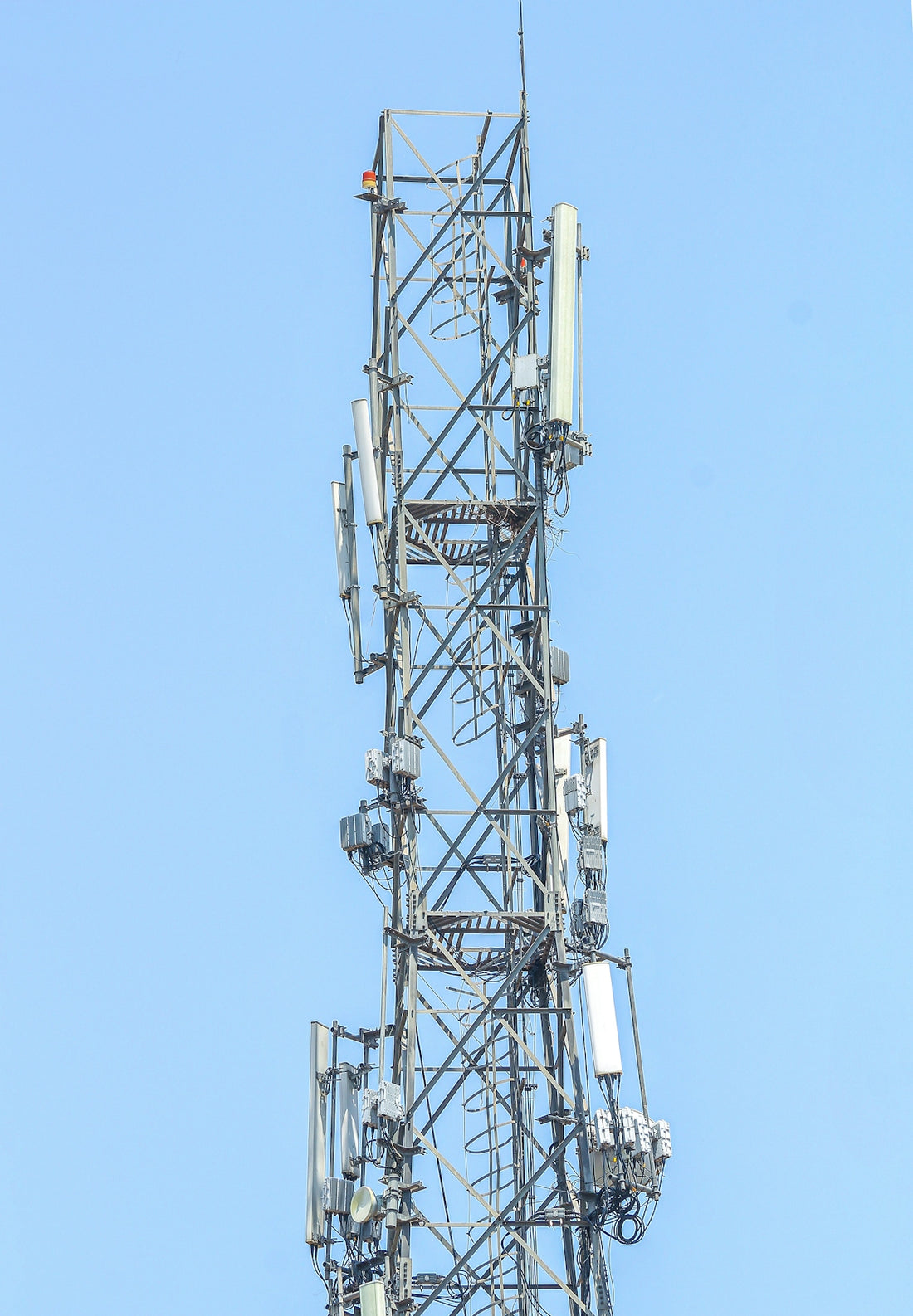 a very tall tower with lots of antennas on top of it