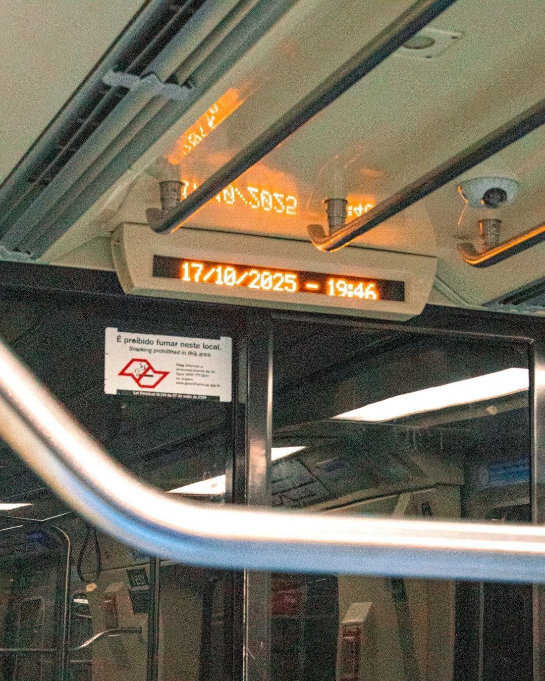 Digital display showing date and time inside vehicle.