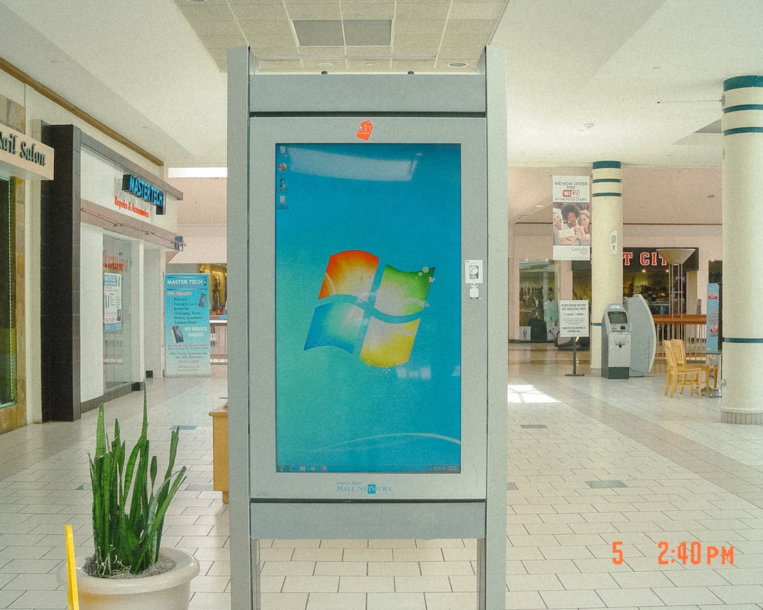 Windows logo displayed on a digital kiosk in a mall.
