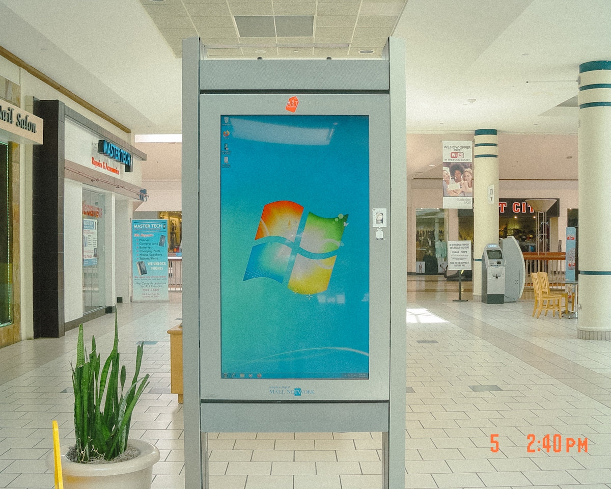 Windows logo displayed on a digital kiosk in a mall.