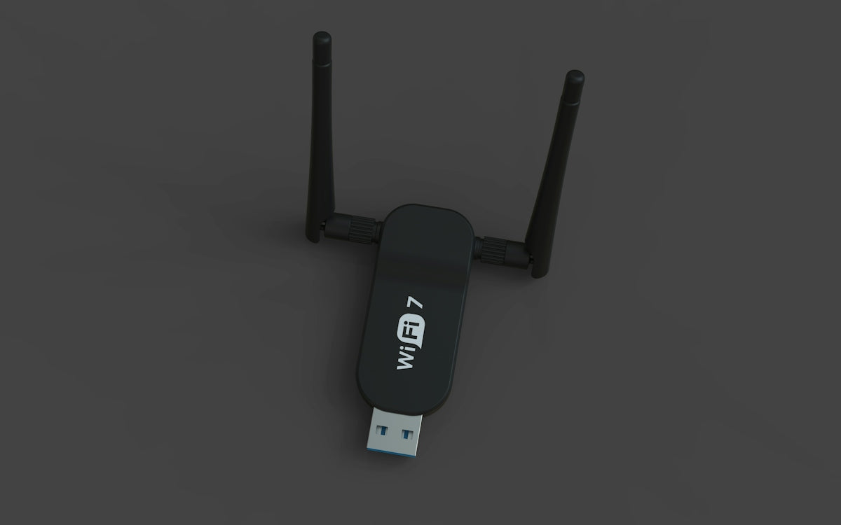 A black usb wifi 7 adapter with two antennas.